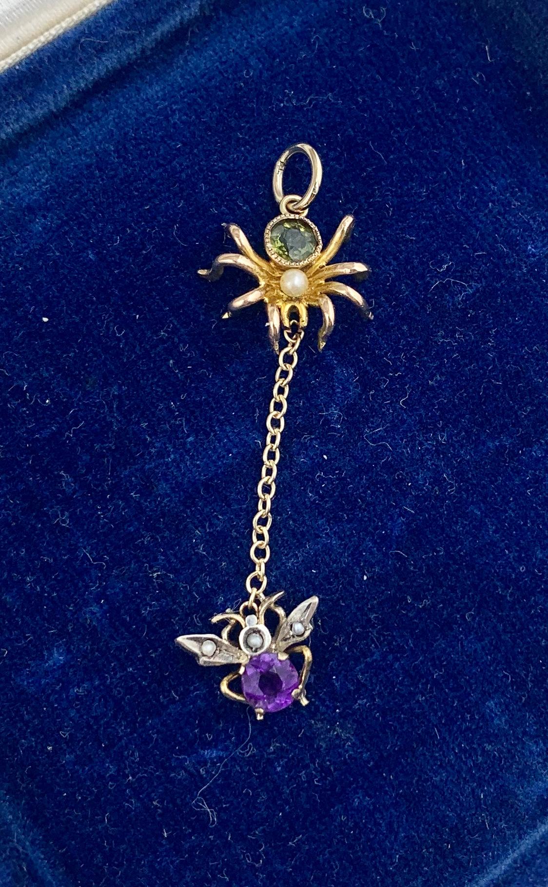 A stunning and rare antique Edwardian Spider and Fly Pendant set with gorgeous green Peridot and purple Amethyst gems in 9 Karat Gold.  Purple and Green are the Suffragette colors and the pendant dates to the Suffragette period.  What a fabulous
