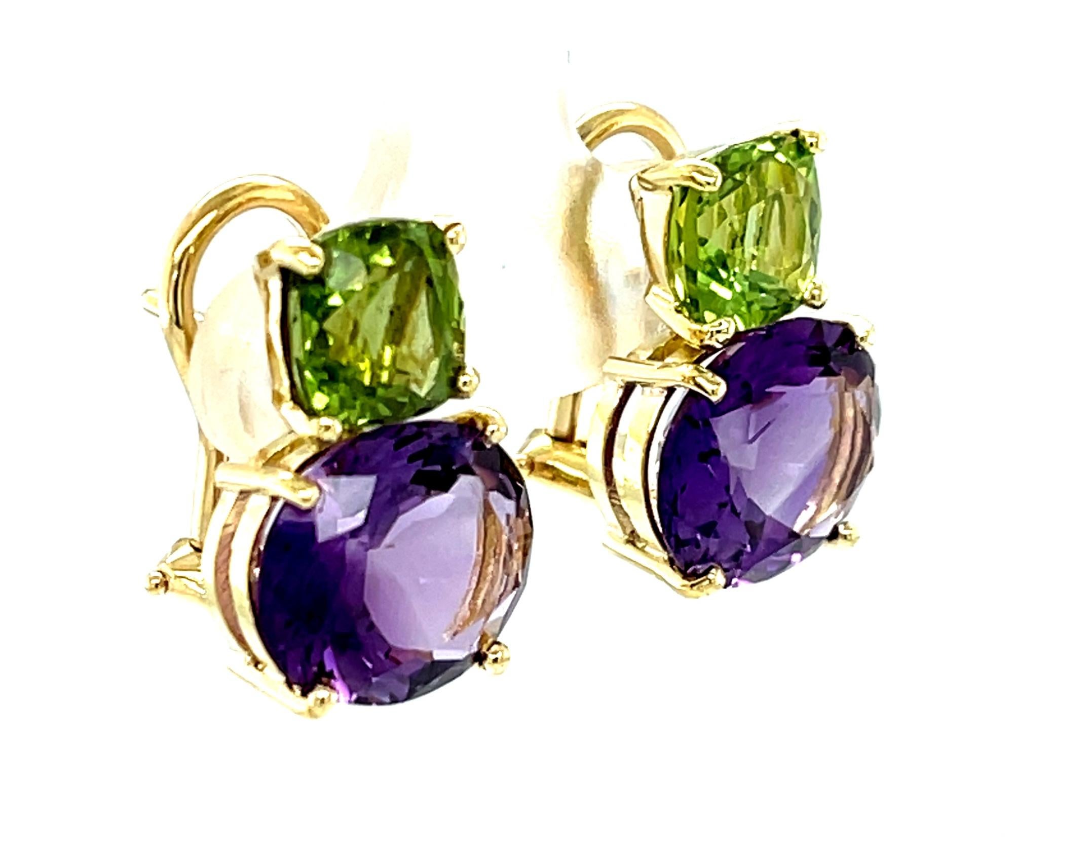 These beautiful color-blocked earrings feature a gorgeous pairing of apple green peridots and bright purple amethysts set in elegant 18k yellow gold baskets. The gemstones are so lively and brilliant, with colors that complement each other