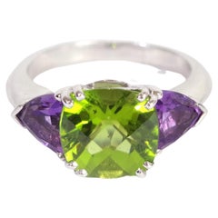 Retro Peridot and amethyst trilogy ring in 18 karat gold