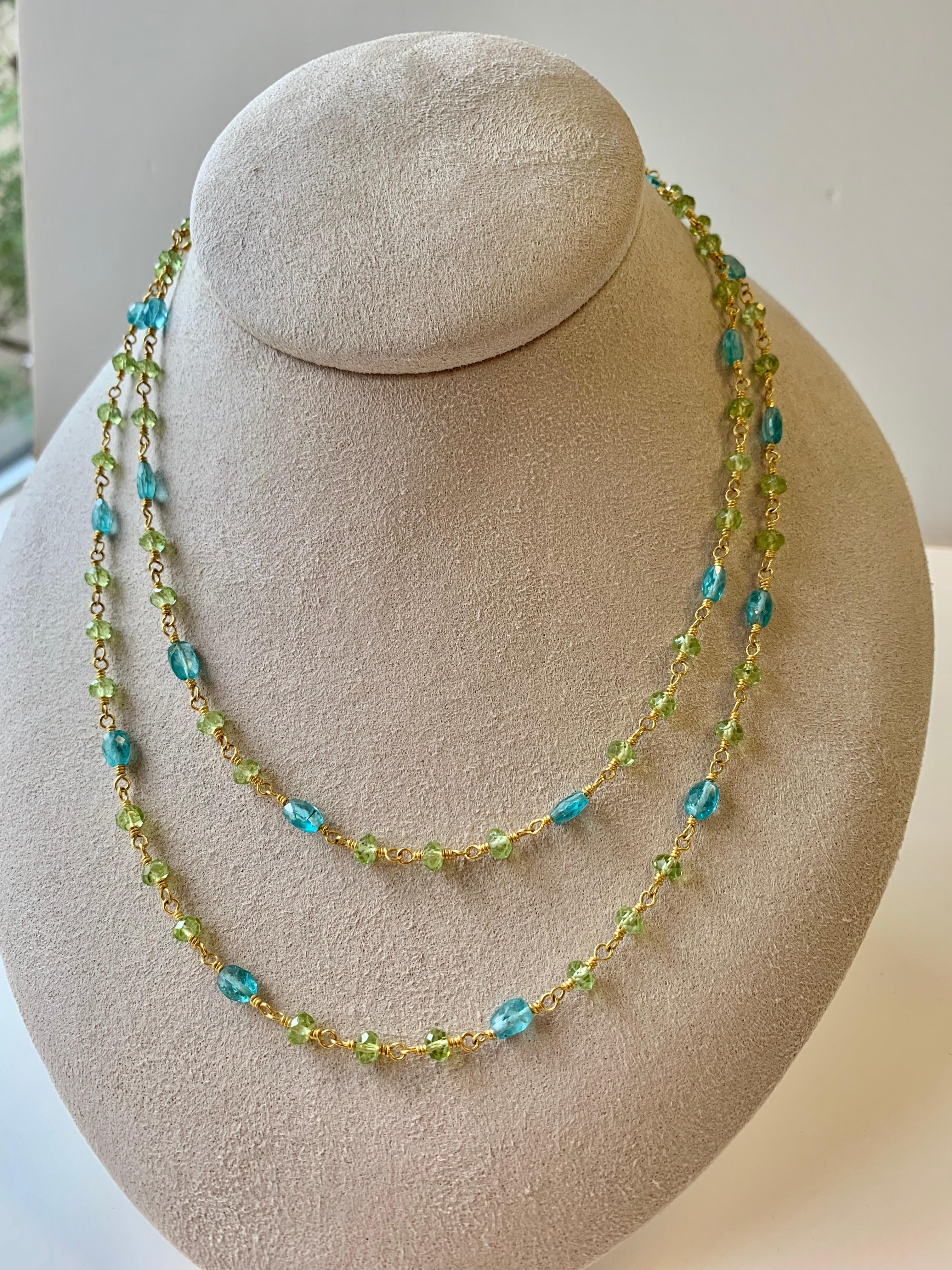 Long necklace-sautoir 34.75 inches of Peridot beads and Apatite beads very lively and colorful.
Hand made of 22 karat gold & 20 Karat gold. Can be worn either long or doubled up.
Can also be worn coupled with long 22 Karat gold Sailor's knot chain