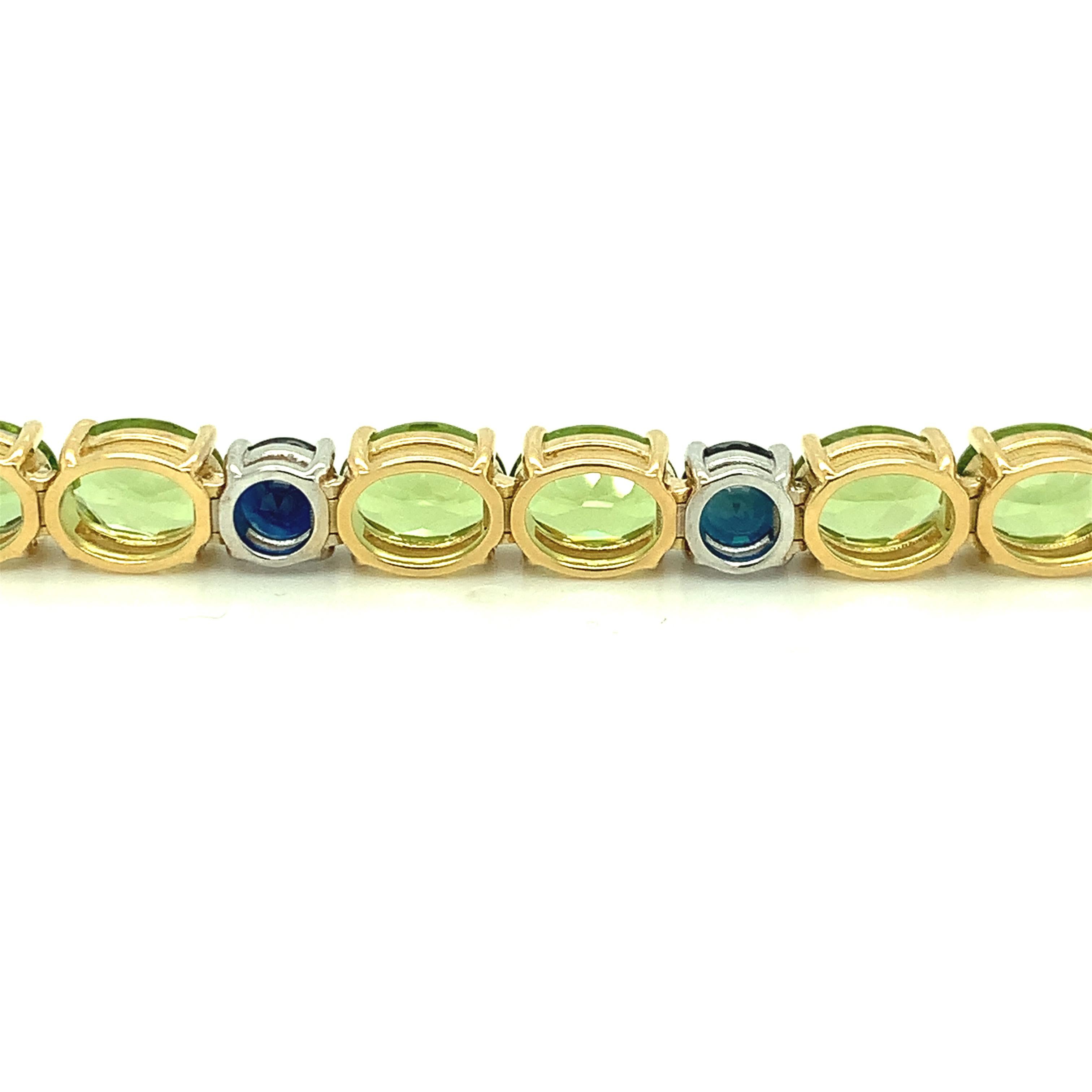 Round Cut Peridot and Blue Sapphire, Yellow, White Gold Tennis Bracelet, 24.20 Cts. t.w.