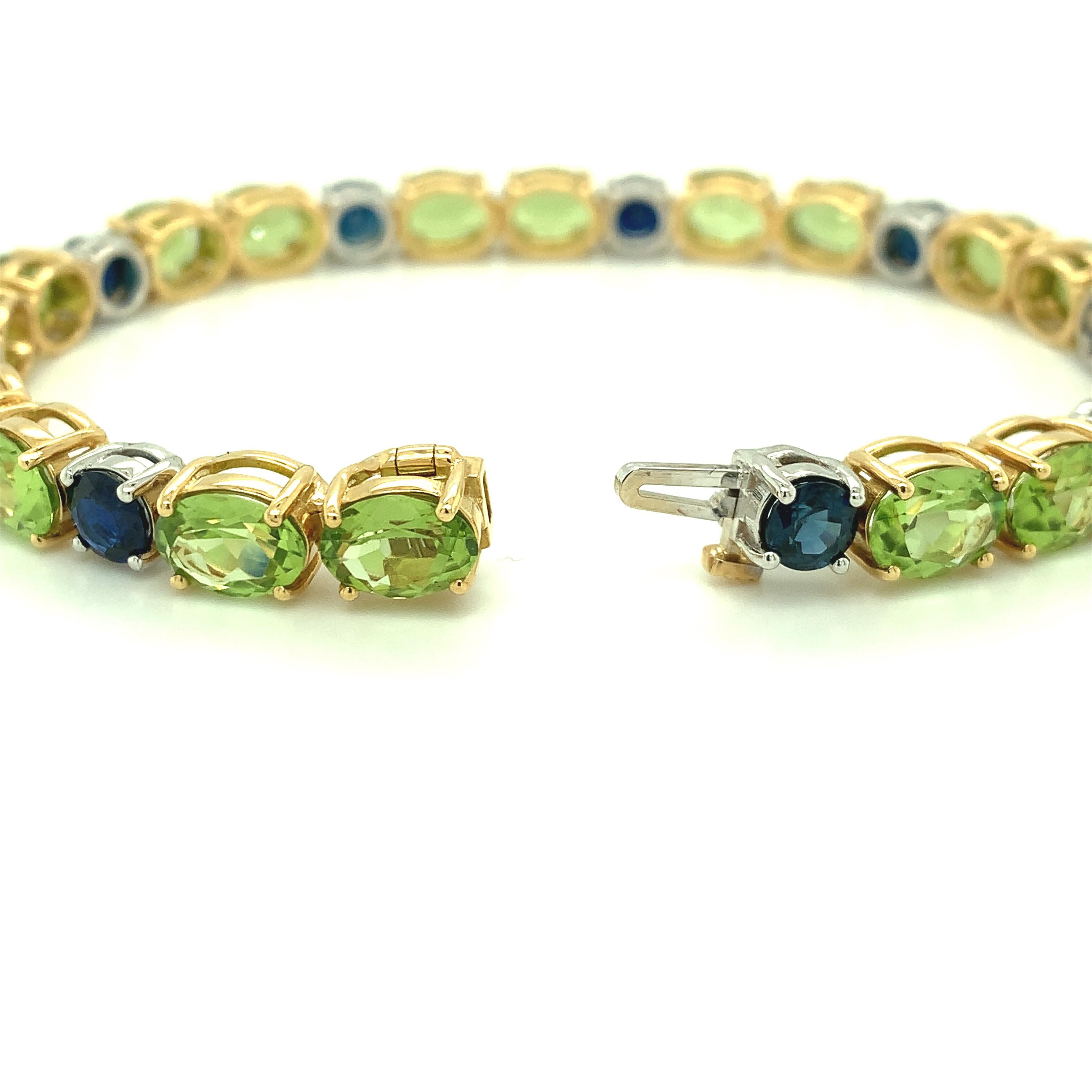 Peridot and Blue Sapphire, Yellow, White Gold Tennis Bracelet, 24.20 Cts. t.w. In New Condition In Los Angeles, CA