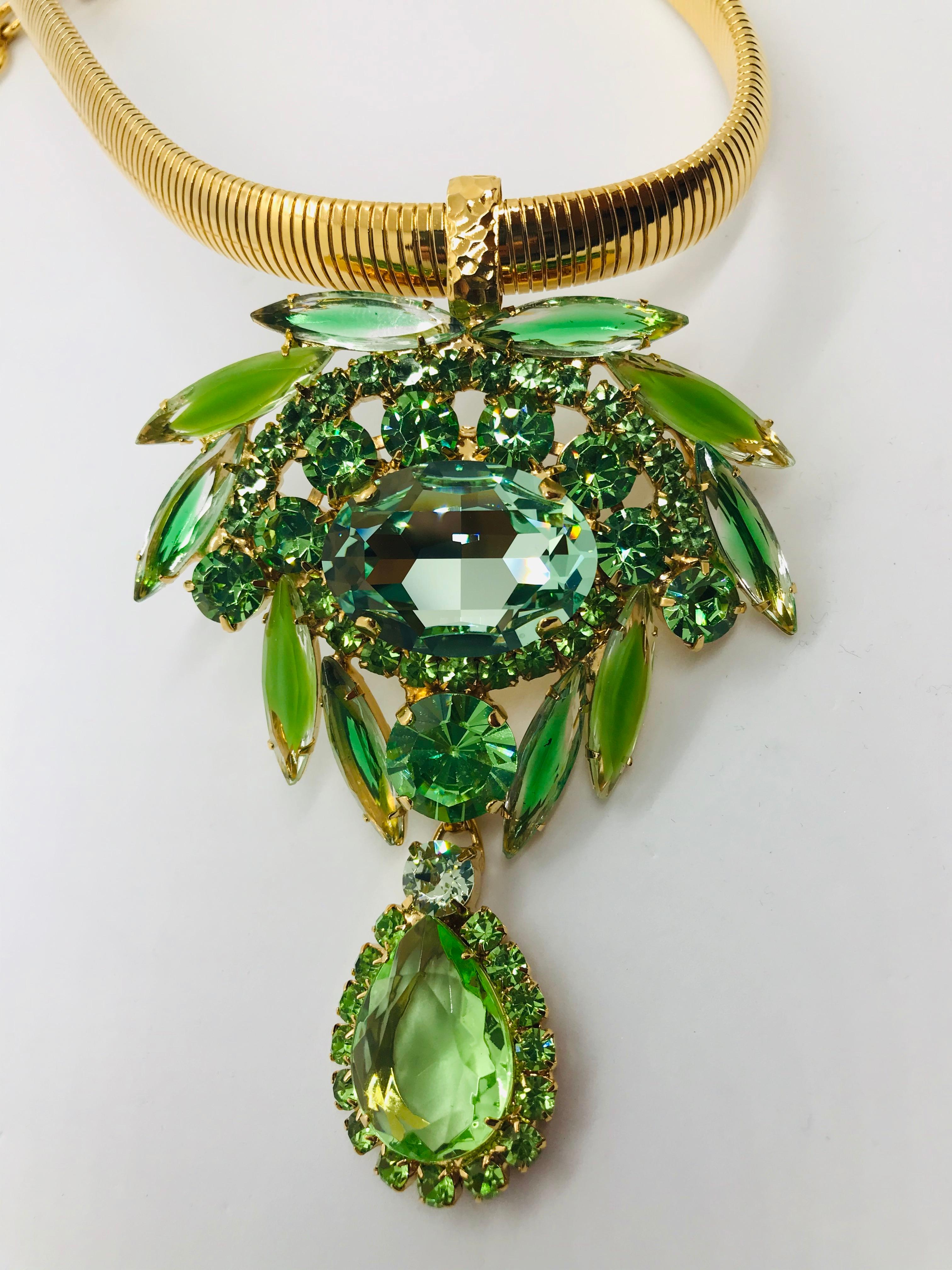 Simplicity and elegance come together in our peridot and chrysolite Austrian crystal machine age pendant.  Reminiscent of jewelry worn by Hollywood movie stars in the 1940s.  Combining vintage and contemporary Swarovski crystals and featuring an