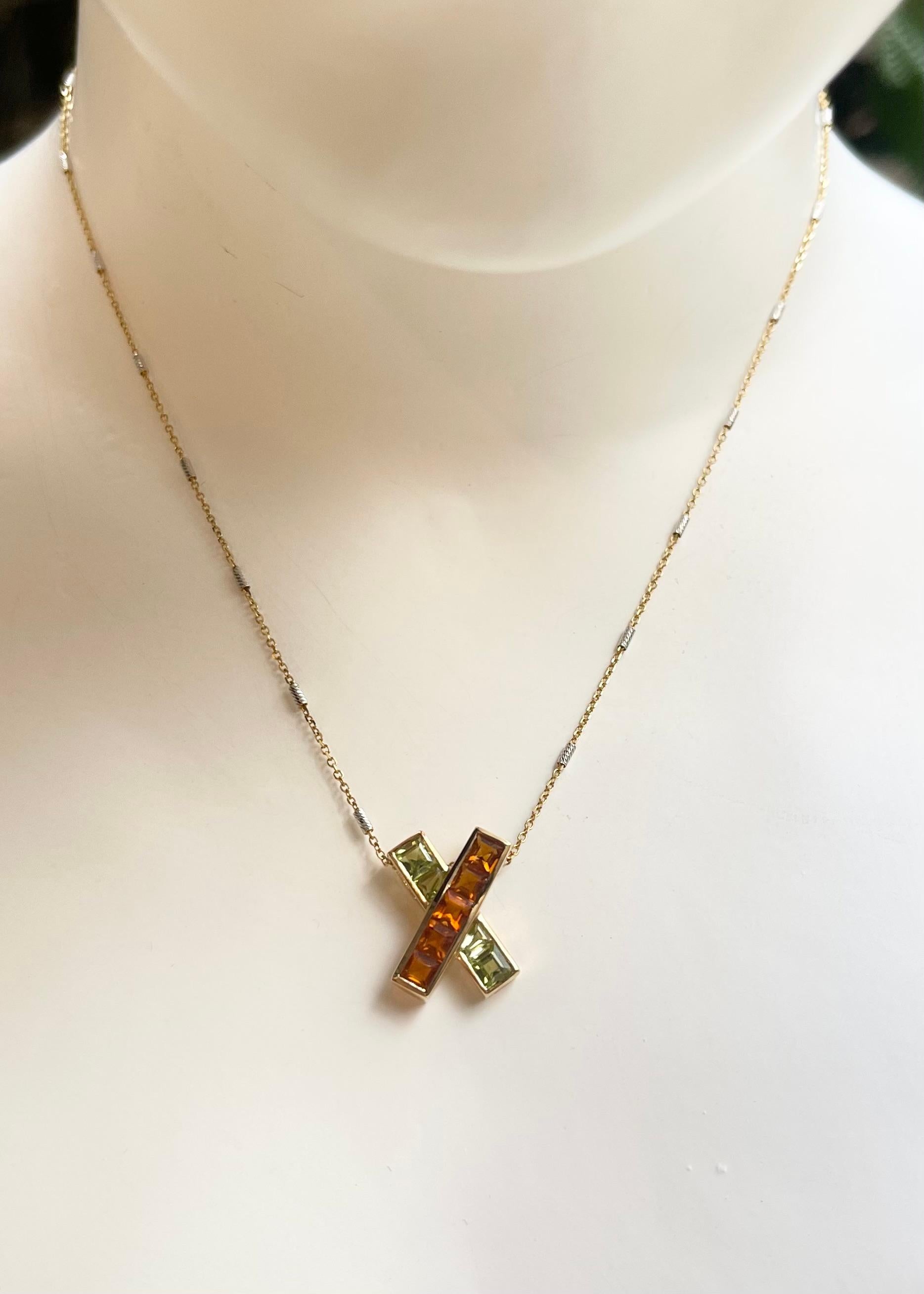 Peridot and Citrine 2.50 carats Pendant set in 14K Gold Settings
(chain not included)

Width: 1.4 cm 
Length: 1.9 cm
Total Weight: 2.71 grams

