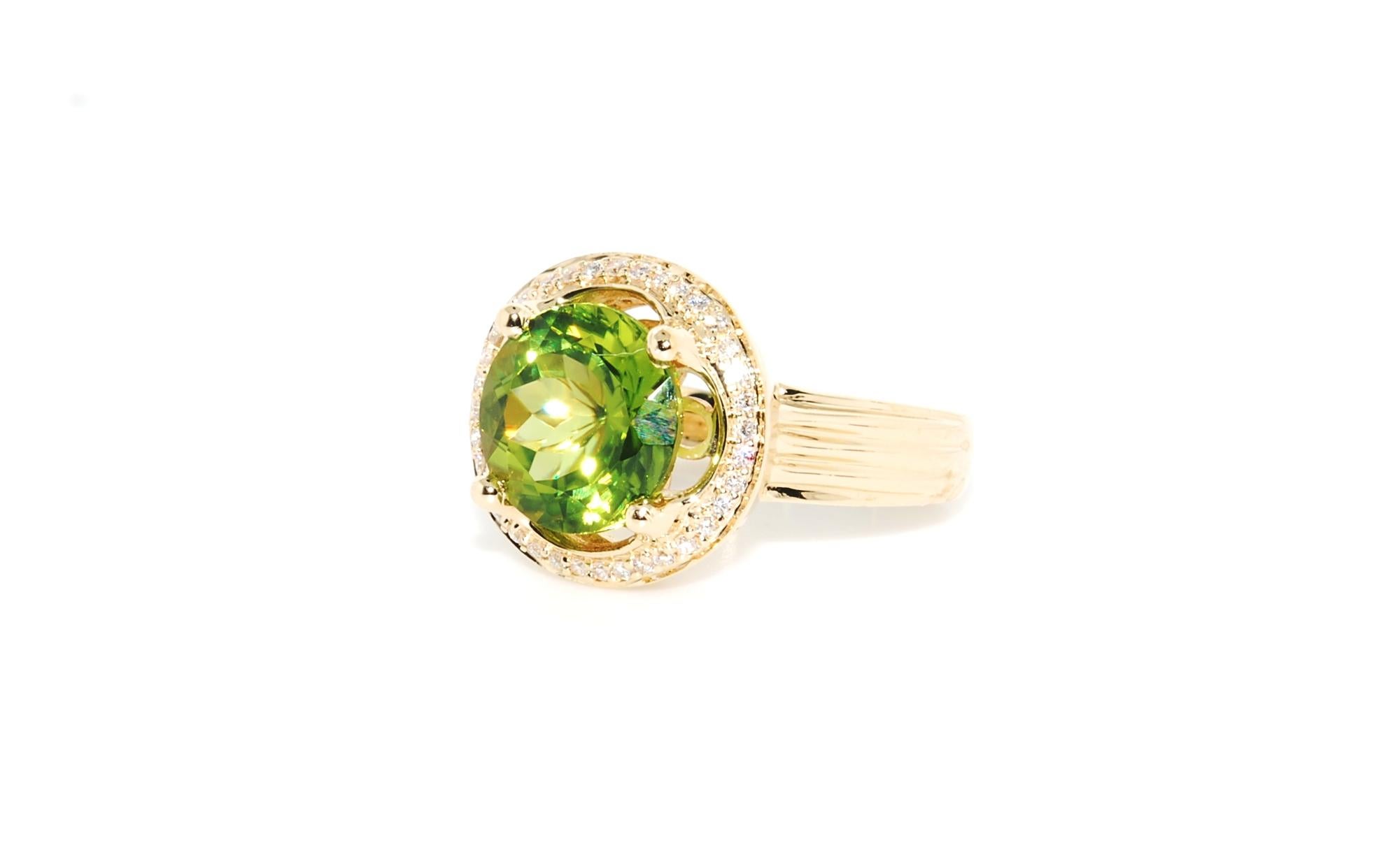Contemporary Peridot and Diamond Cocktail Ring in 14 Karat Yellow Gold For Sale