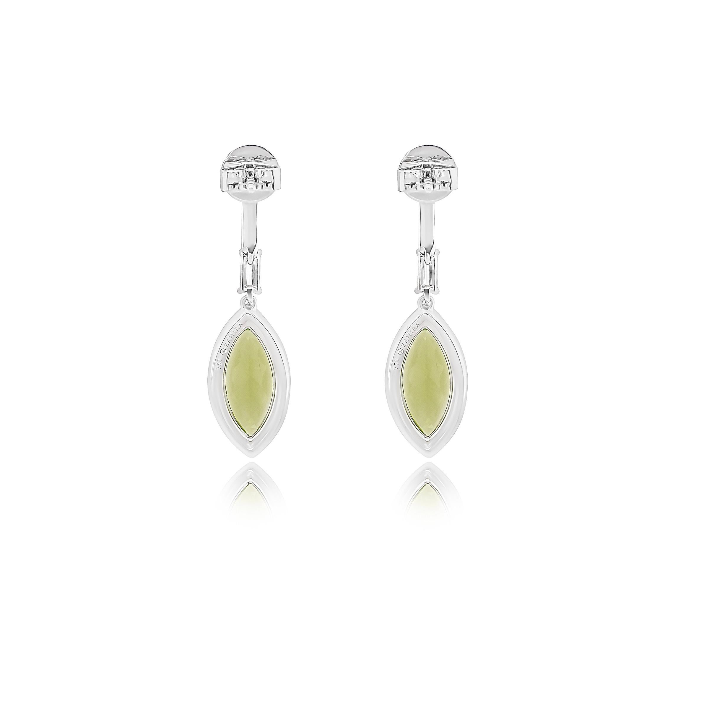 Make a statement with these exquisite earrings, featuring two striking marquise-cut peridots with a total weight of 4.940 carats. Their vibrant green hue is beautifully complemented by a delicate halo of .41 carats of sparkling natural diamonds,