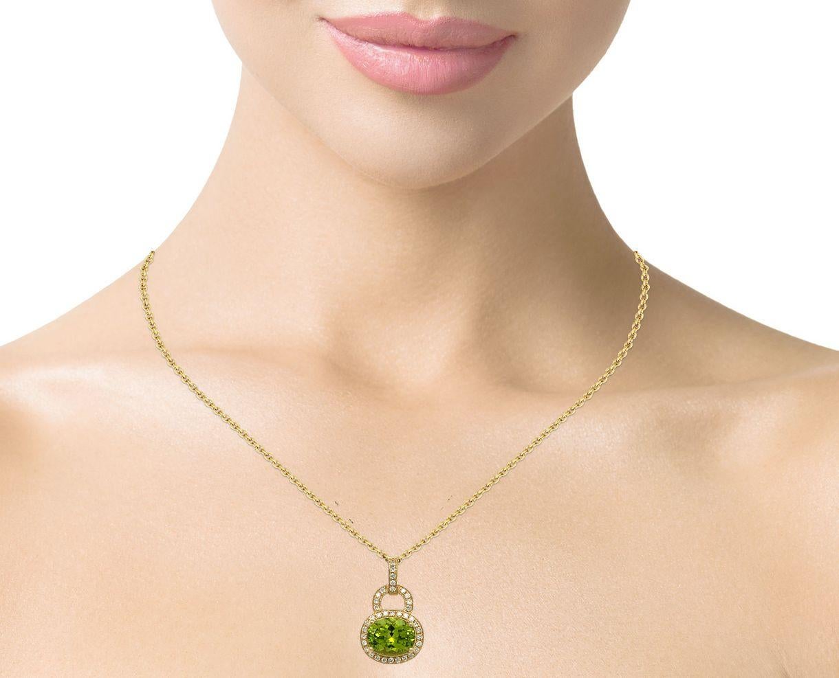 This elegant oval Peridot and diamond pendant is beautiful to wear everyday. It has a 4 prong setting in 14 karat yellow gold. Comes with a gold plated chain, gold chain sold separately. Pendant is brand new with detailed tags attached and comes in