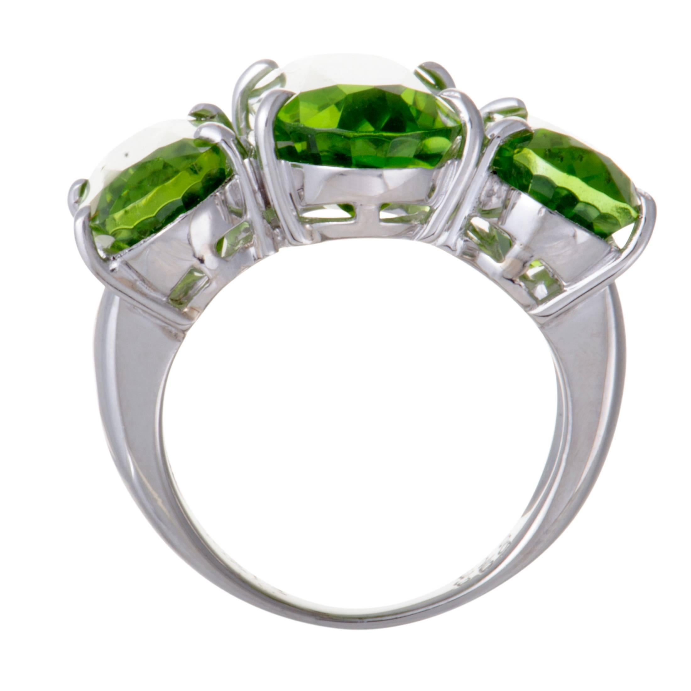Stealing the show in an exceptionally imposing manner, the peridot stones stand out magnificently against the prestigious gleam of platinum in this fabulous ring. The peridots amount to 22.41 carats, and the ring also boasts 0.21 carats of sumptuous