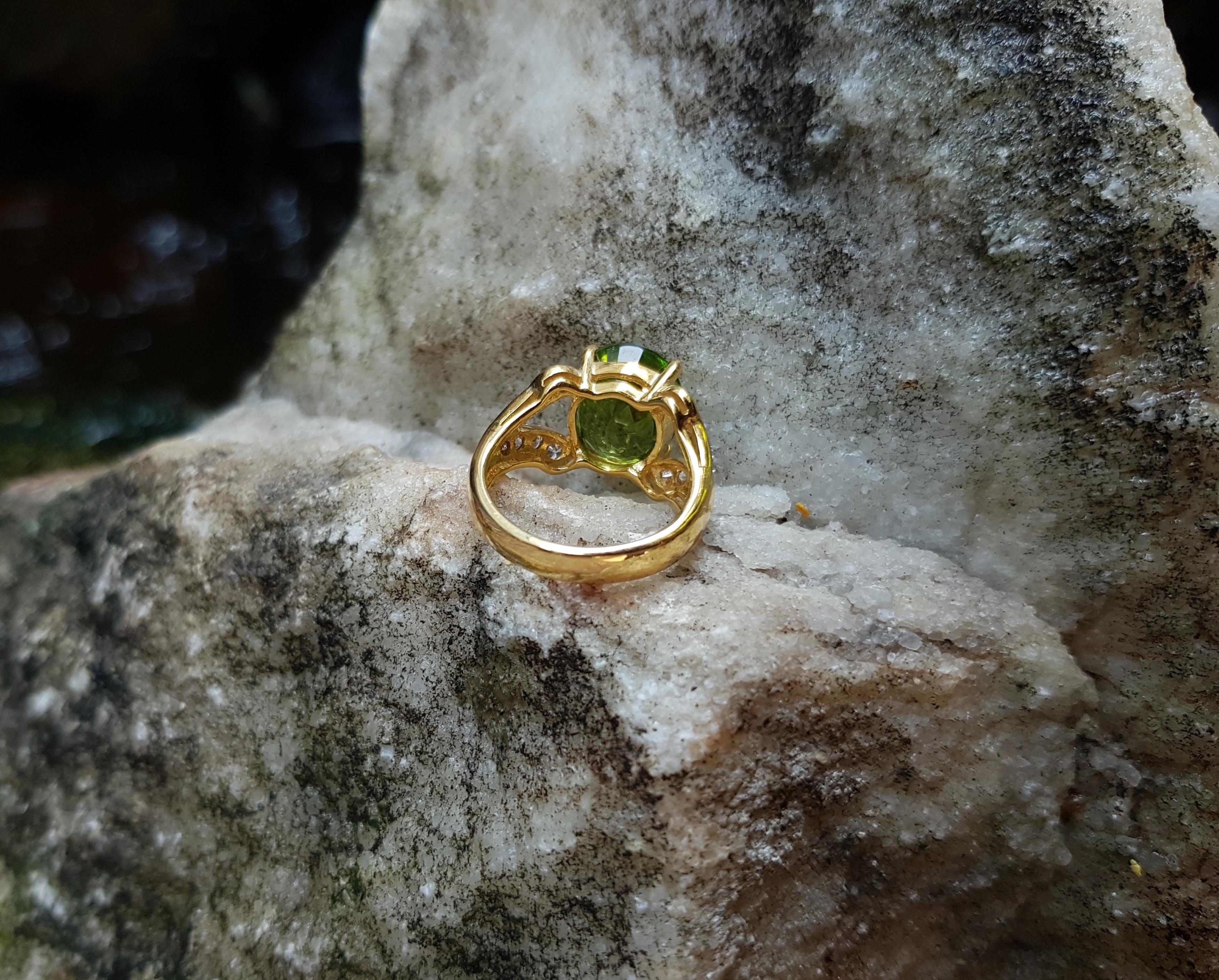 Oval Cut Peridot and Diamond Ring in 18k Gold Setting For Sale