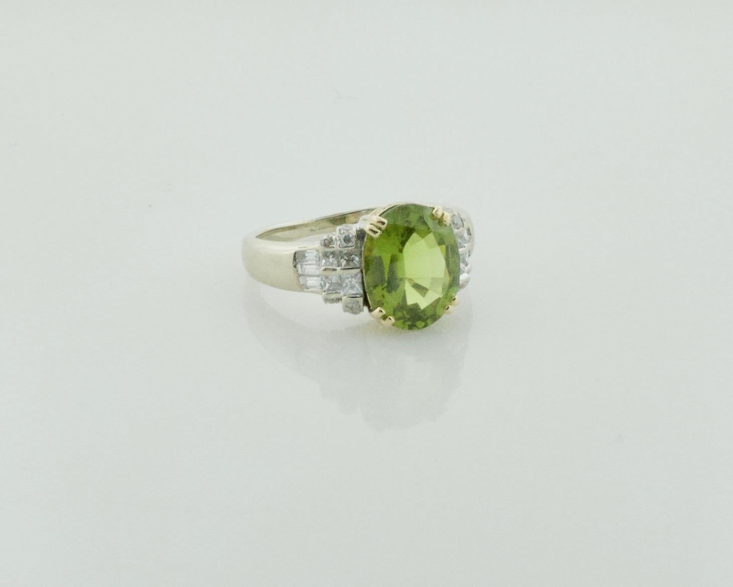 Peridot and Diamond Solitaire Ring in 18k

Introducing the stunning Lady’s 18K Yellow & White Gold Diamond/Peridot Ring - a true statement piece that exudes luxury and elegance. Crafted with care and precision, this exquisite ring features a
