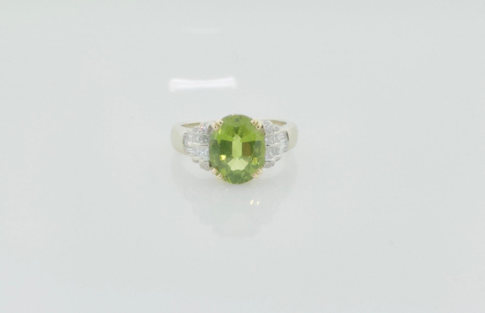 Oval Cut Peridot and Diamond Solitaire Ring in 18k For Sale