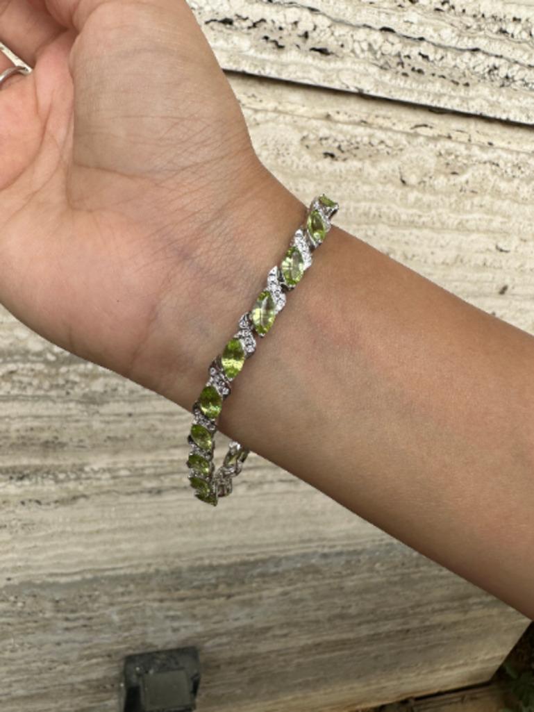 Peridot and Diamond Wedding Bracelet for Women in Sterling Silver showcases endlessly sparkling natural peridot, weighing 12.3 carat. It measures 7.5 inches long in length. 
Peridot improves mental strength.
Designed with perfect marquise cut