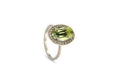 Peridot and diamonds 14k gold ring.