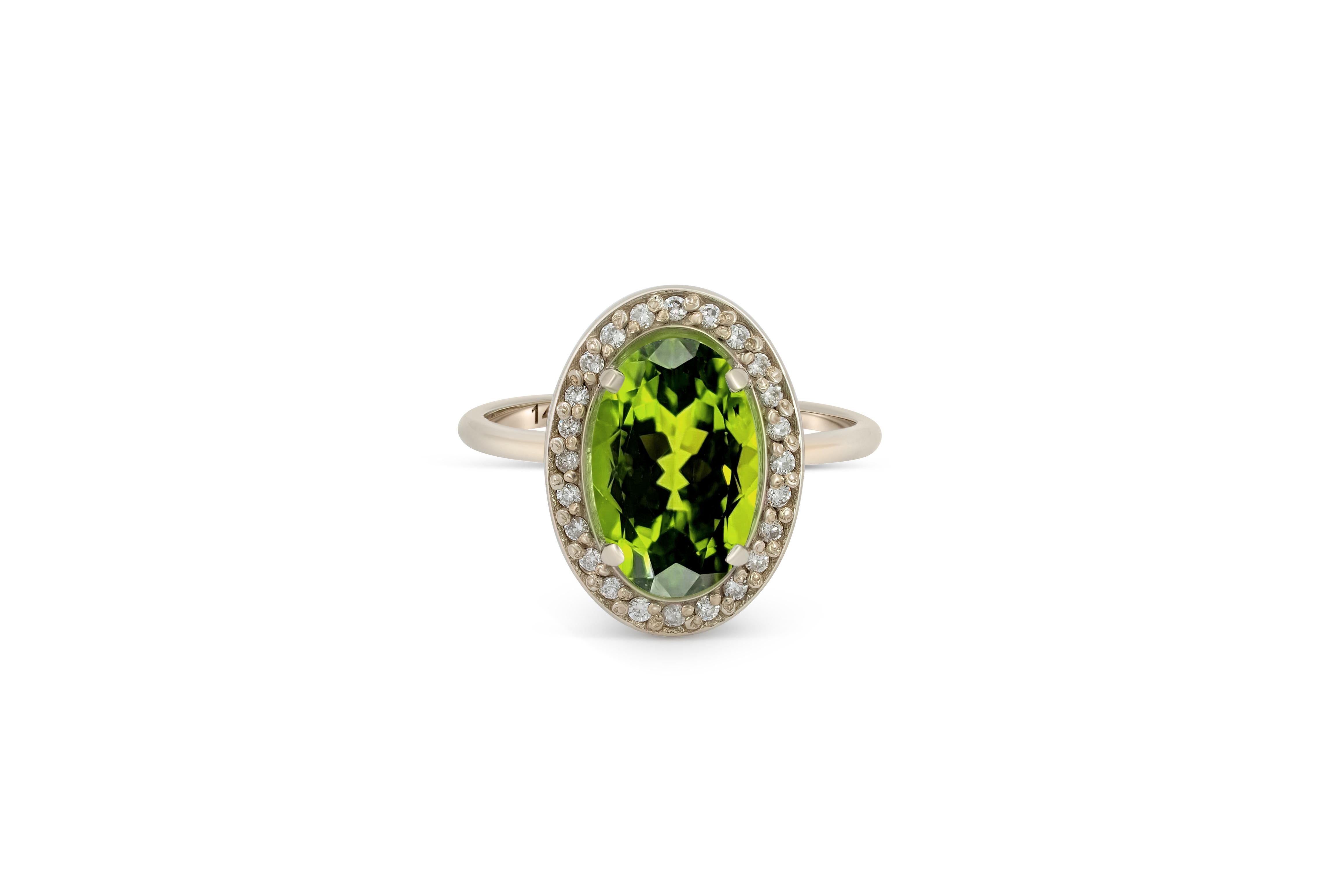 Oval Cut Peridot and diamonds 14k gold ring.  For Sale