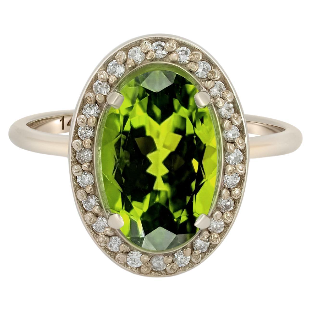 For Sale:  Peridot and diamonds 14k gold ring.