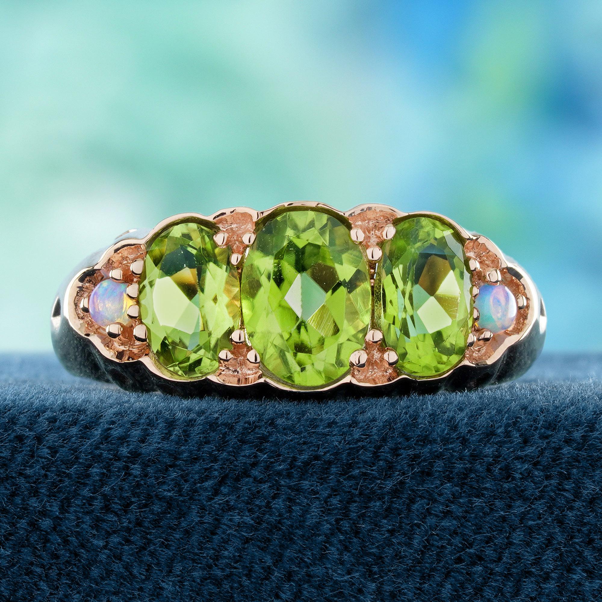 Three-stone ring showcases three vibrant natural peridots set in a beautifully crafted design. The stones' vivid green hue is highlighted by delicate detailing on the band, adding a timeless, elegant touch. A stunning piece that effortlessly