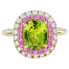 Peridot und rosa Saphir-Diamant-Halo-Ring aus 14 Karat Gelbgold