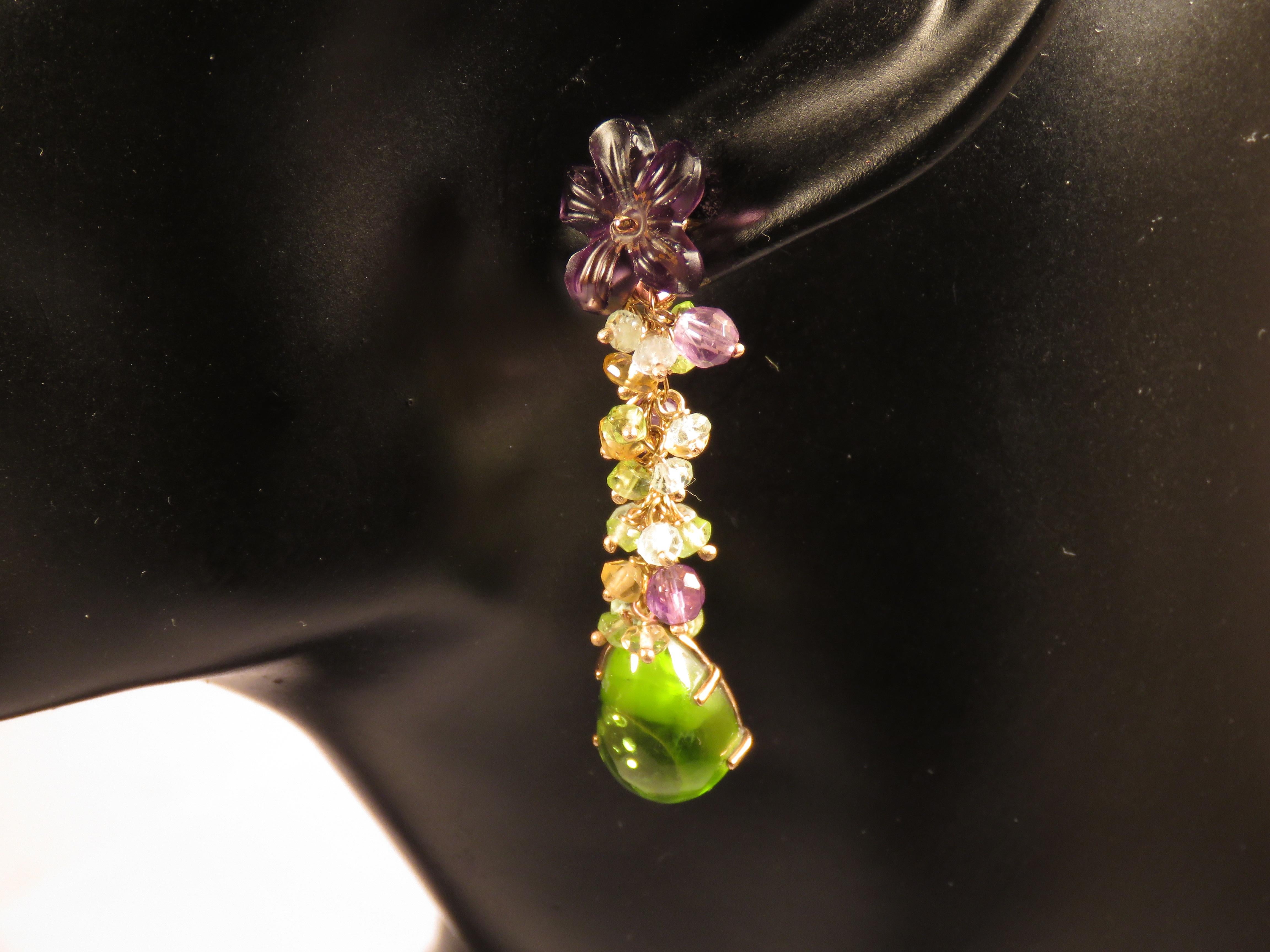 Beautiful earrings in 9 karat rose gold with 2 drops of natural peridot, 2 flowers of natural amethyst and aquamarine, amethyst and topaz gemstones in ball cut. Total length of each earring is 55 millimeters / 2.165 inches. They are handcrafted in
