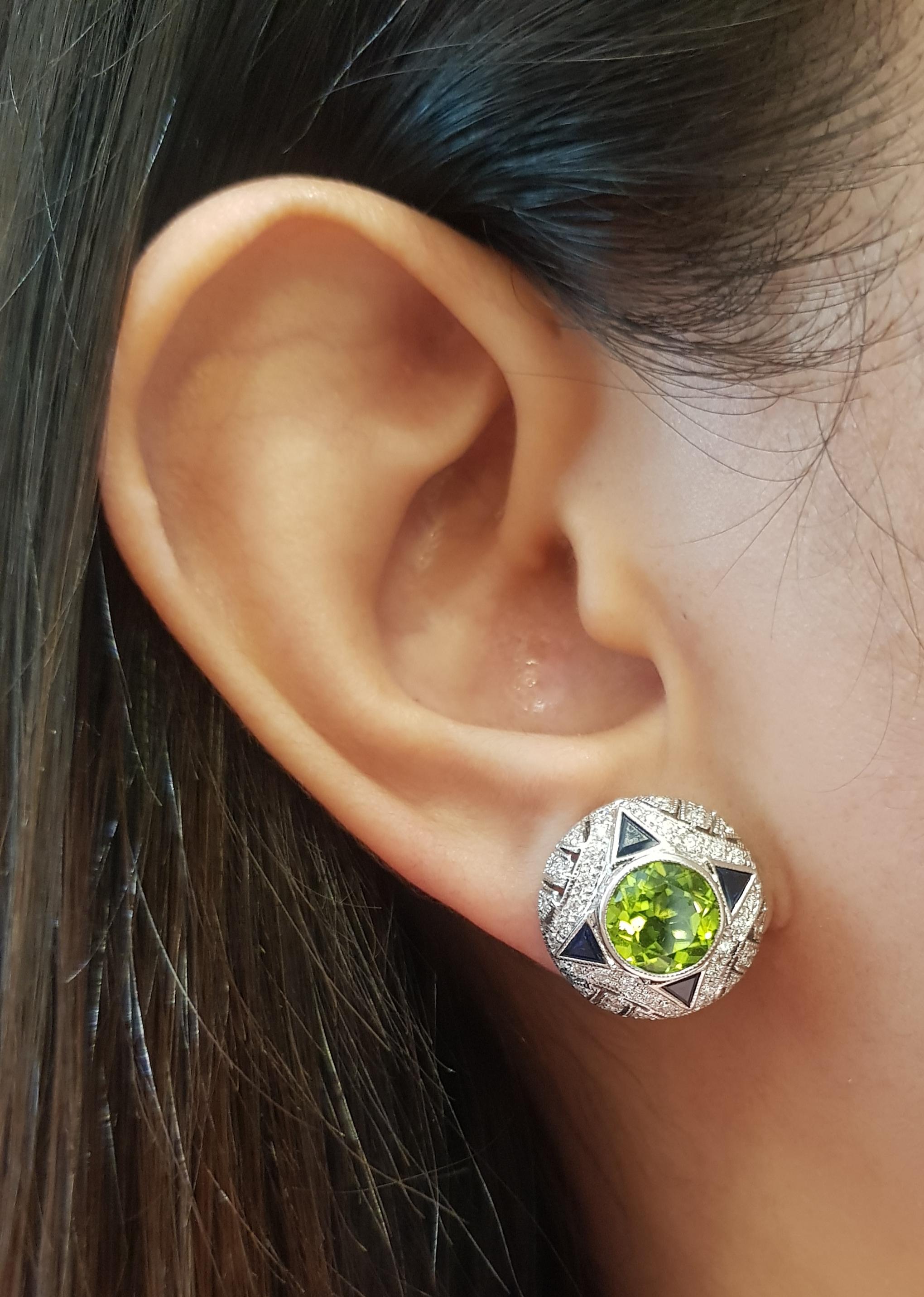 Peridot 3.81 carats, Blue Sapphire 1.27 carats and Diamond 0.70 carat Earrings set in 18 Karat White Gold Settings

Width: 1.5 cm 
Length: 1.5 cm
Total Weight: 12.07 grams

