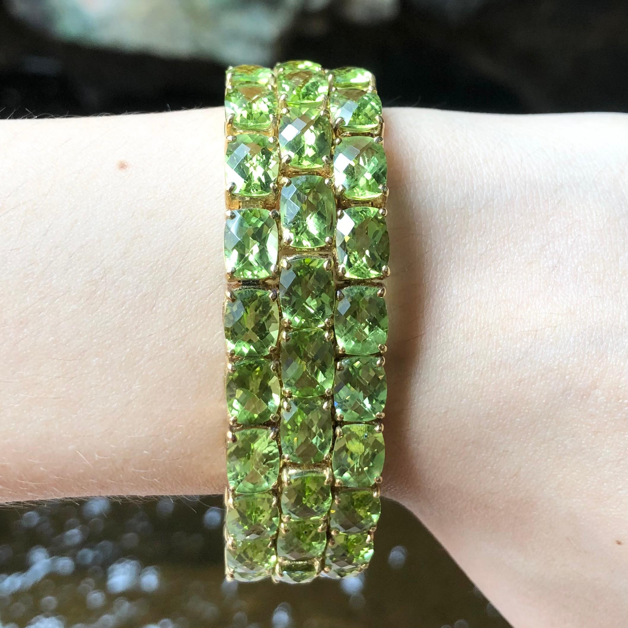 Peridot 87,67 Karat Armband in 14 Karat Goldfassung

Breite:  1.8 cm 
Länge: 18,0 cm
Gesamtgewicht: 61,21 Gramm


