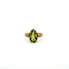 Anello con peridoto e diamanti color champagne in oro giallo 18 carati per lei