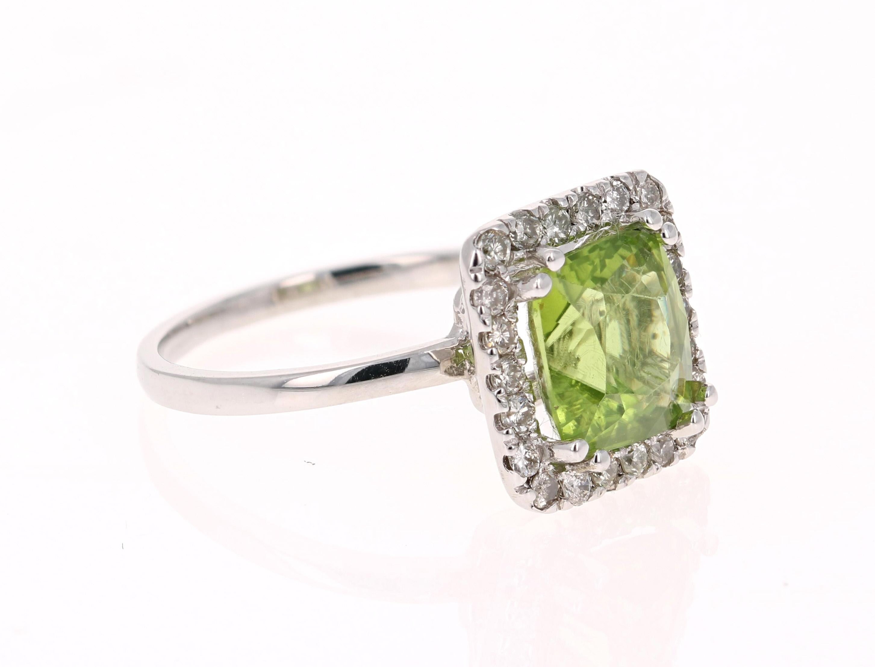 Bright & Beautiful!

This Peridot and Diamond Ring has a 3.11 Carat Square Cushion Cut Peridot and has 22 Round Cut Diamonds that weigh 0.41 Carats. The total carat weight of the ring is 3.52 Carats. 

It is set in 14 Karat White Gold and weighs