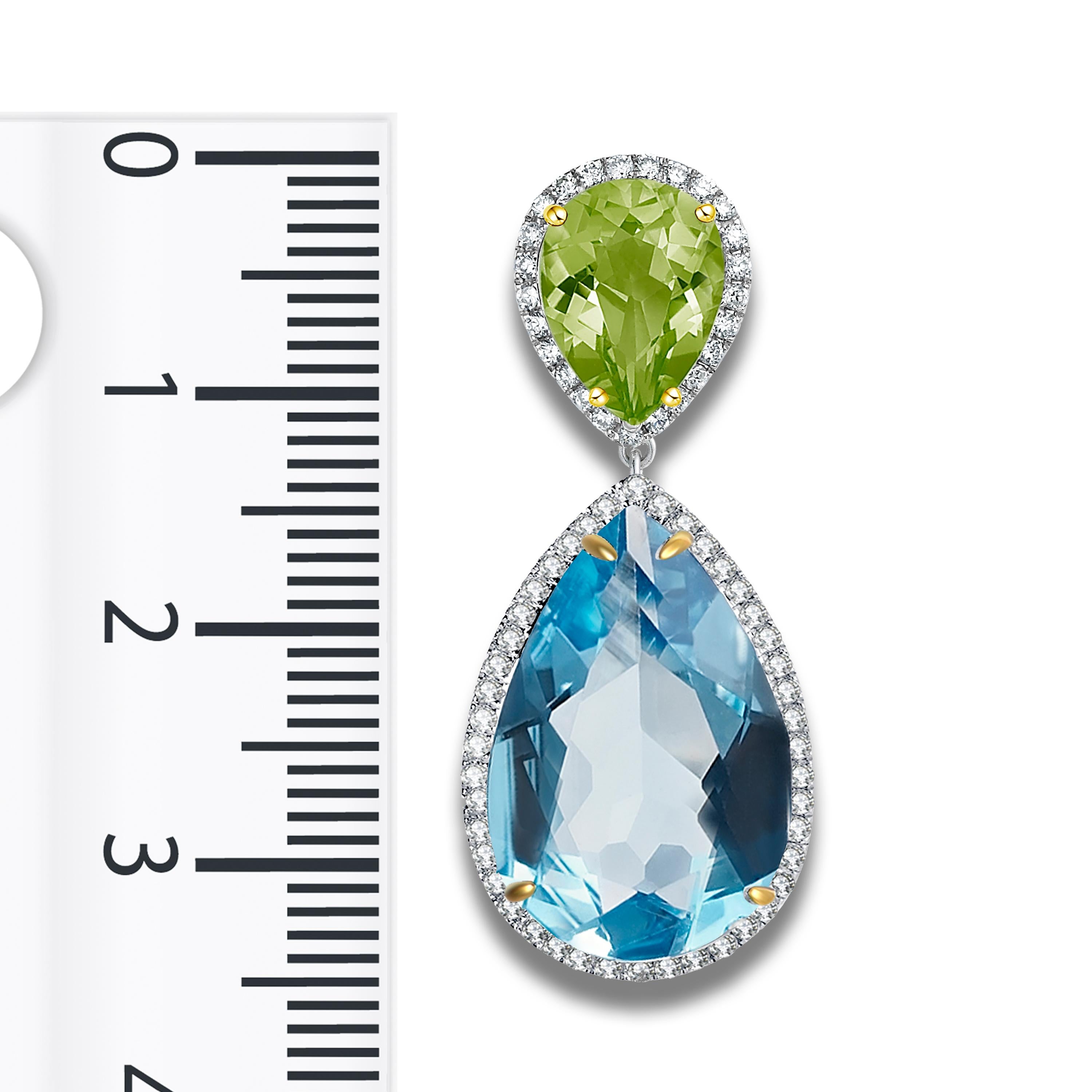 Description:
Add a touch of colour to your look with bright, breathtaking gemstones. These drop earrings feature 5.20ct peridots and 26.40ct blue topazes decorated with 1.06ct diamonds, set in 18ct white gold with yellow gold-plated