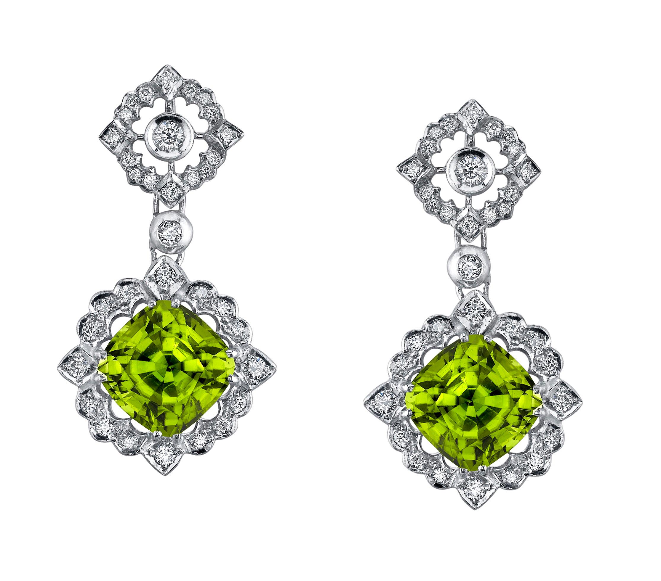Peridot earrings for women, unveiling a pair of remarkable 12.89 carat total cushion cut Peridots, and a total of 1.00 carat diamonds, set in 18K white gold.
Total length: 1.5 inches.
Returns are accepted and paid by us within 7 days of