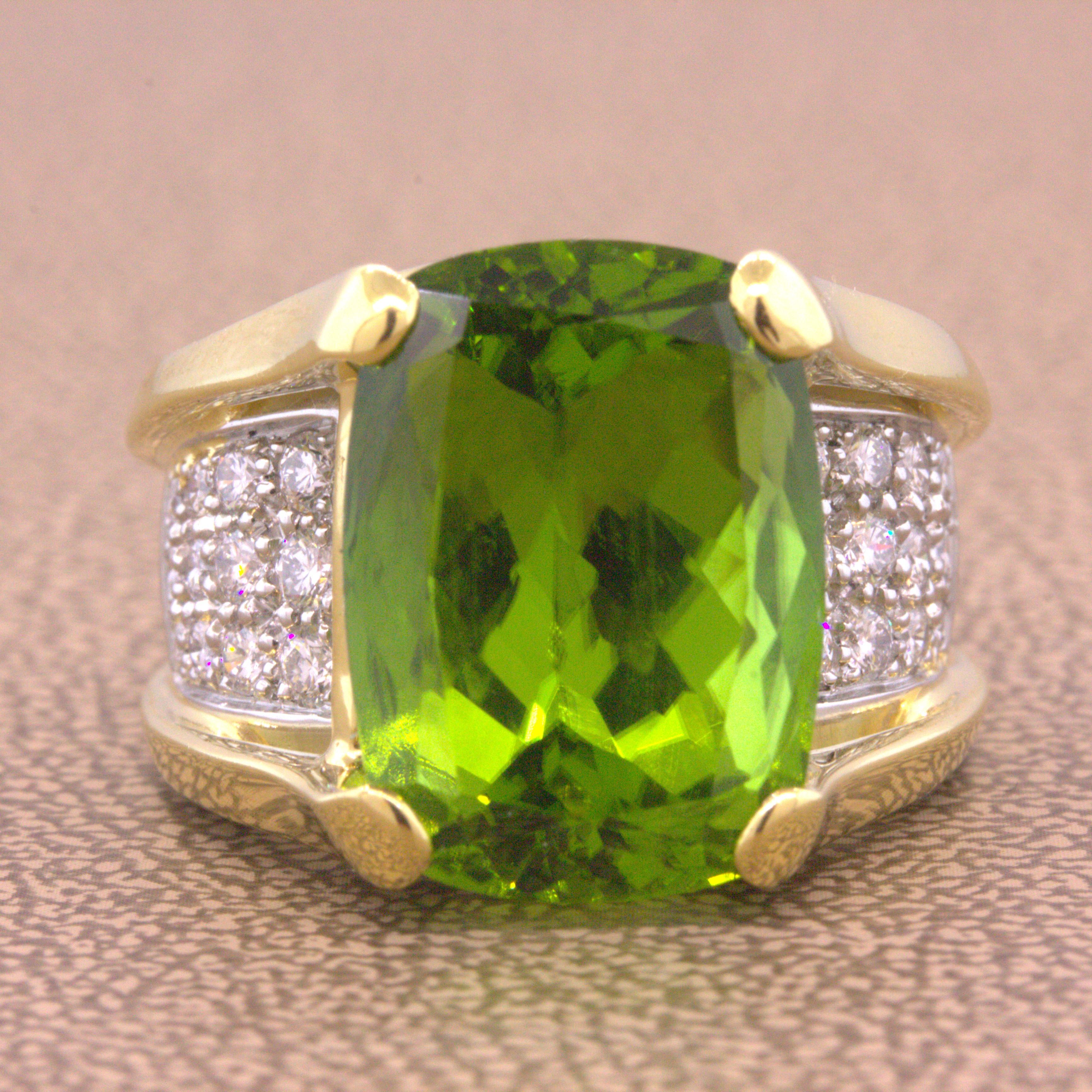 A beautiful ring featuring a large and impressive peridot weighing 11.99 carats which has a rich and vibrant green color. It is complemented by 0.61 carats of round brilliant-cut diamonds which add brilliance and sparkle to the statement piece. Made