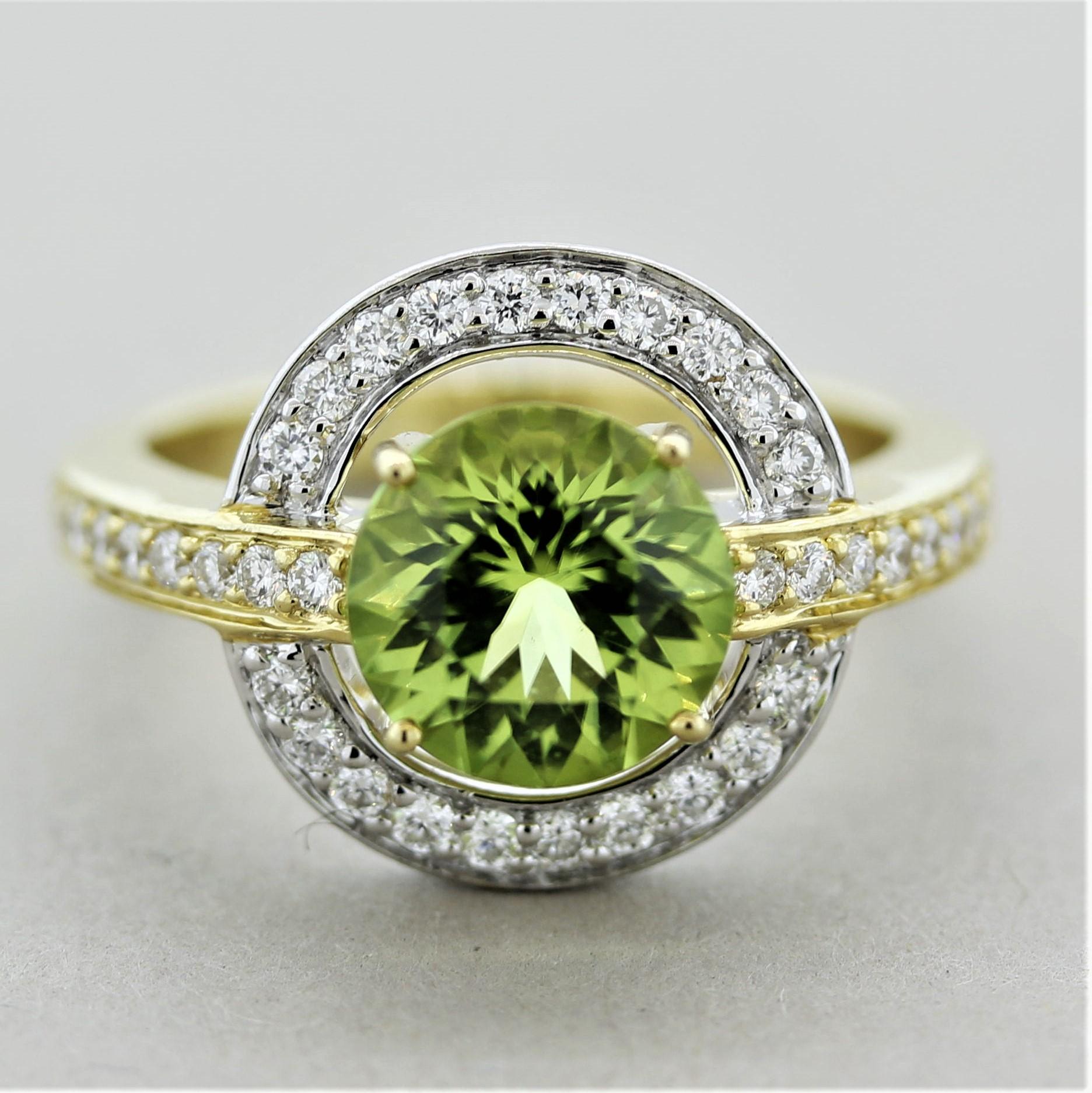 A chic and fashionable diamond gemstone ring! It features a bright and vibrant peridot weighing 2.31 carats which is accented by 0.41 carats of round brilliant-cut diamonds adding brilliance and sparkle to the piece. Made in both 18k white and
