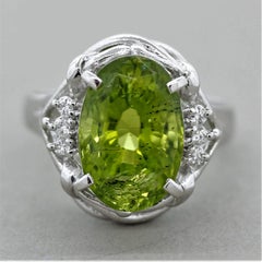 Anello in platino con diamante peridoto