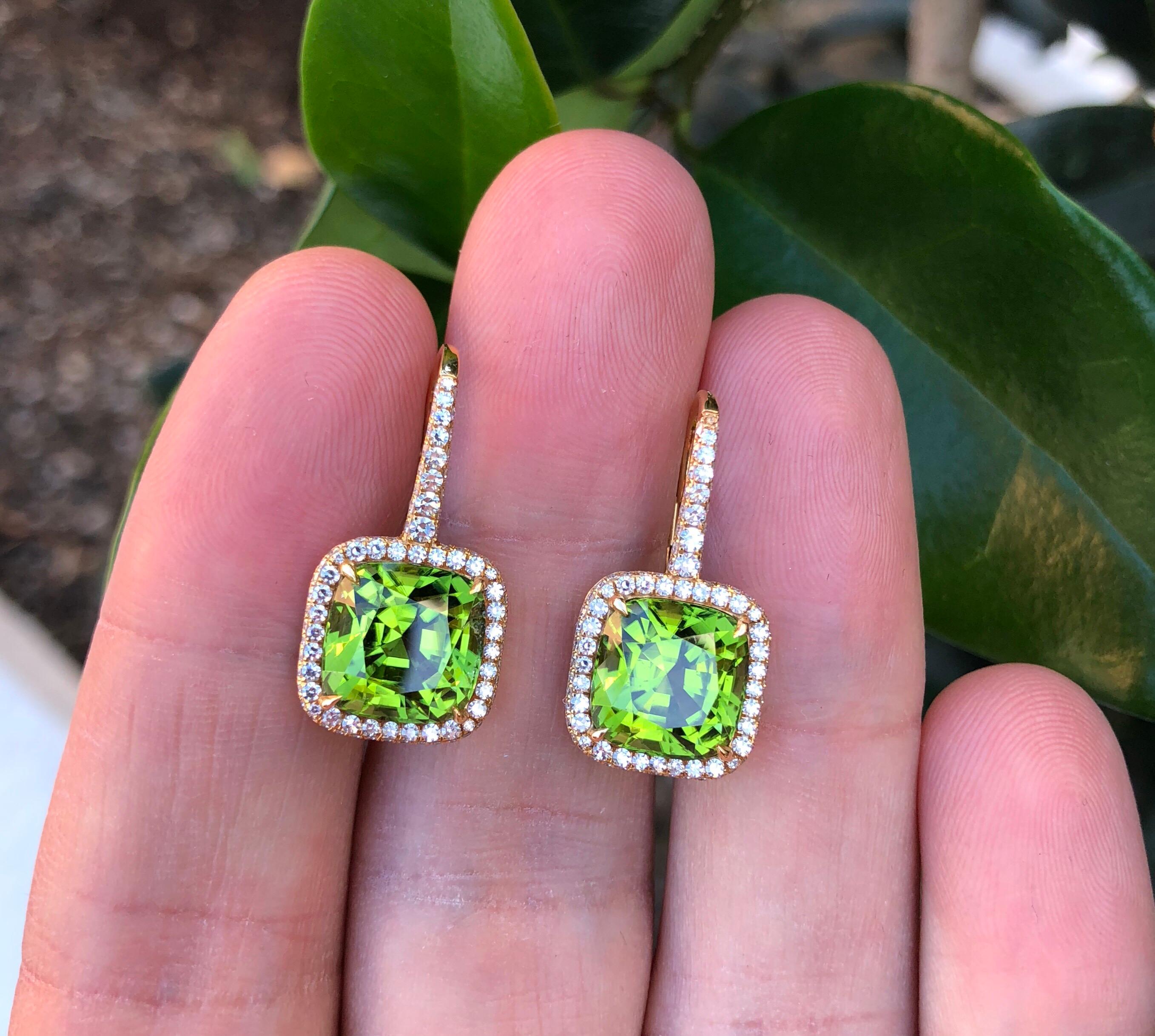 An ultra fine pair of 9.46ct total cushion-cut green Peridot, set in French rose gold and surrounded by 0.94ct F-G color and VS clarity diamonds. 
Signed Tamir.
Crafted by hand in the USA.

***Returns are accepted within 7 days of delivery and will