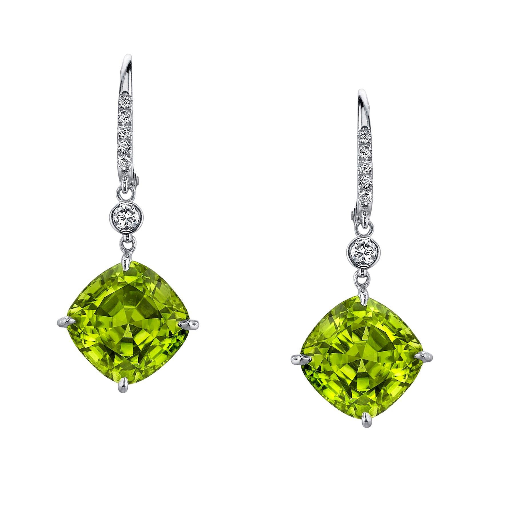 Striking pair of 12.32ct green Peridot cushions, and 0.26ct total round brilliant diamond, 18K white gold lever back Peridot drop earrings.
Total length: Approx. 1.25 inches.
***Returns are accepted and paid by us within 7 days of delivery.

Peridot