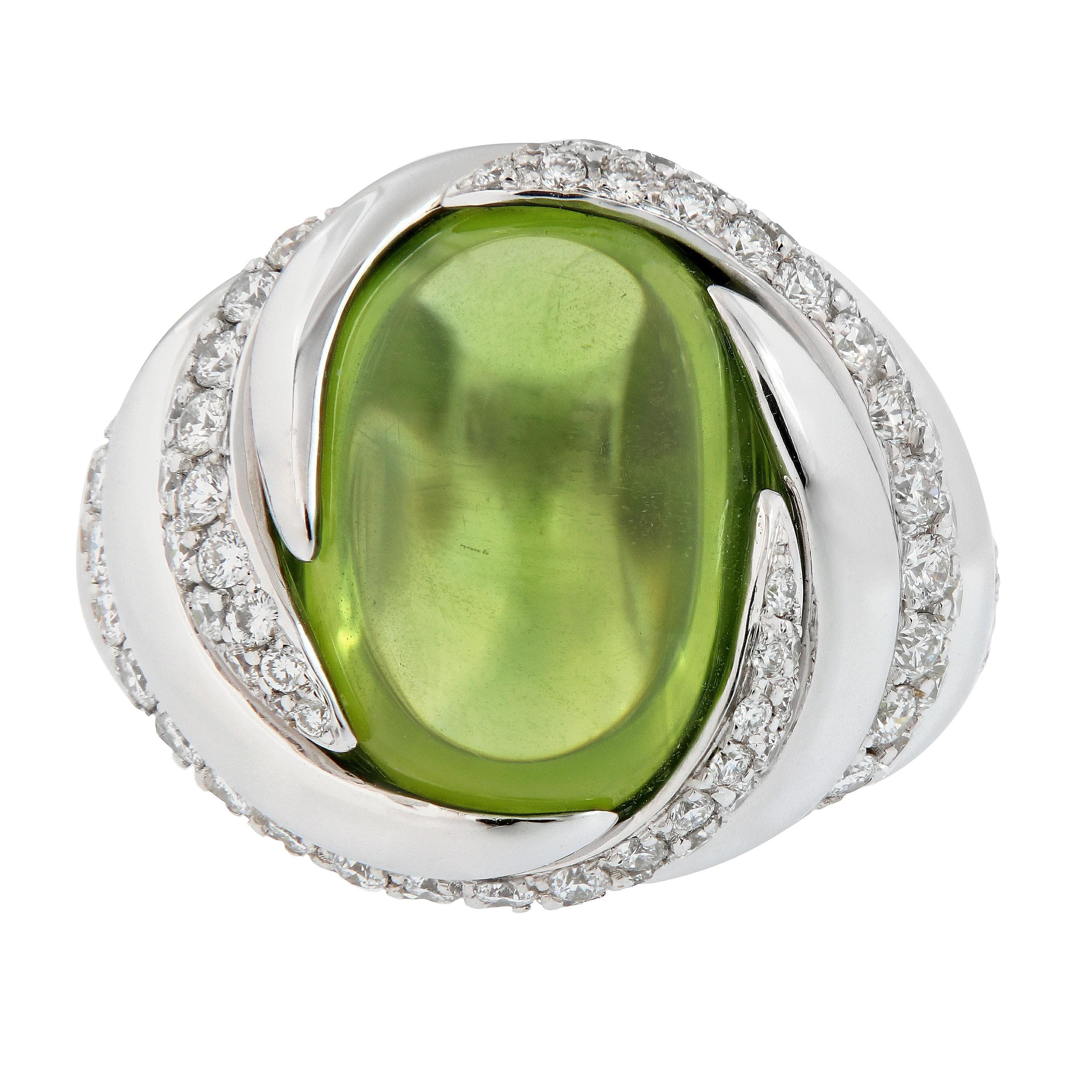 An absolutely gorgeous peridot and diamond ring in 18k white gold. This ring features a 14.05 carat natural peridot accented with a gold and pave set diamond swirl design. Weigh 15.8 grams. Ring size 6.

Peridot 14.05 ct
Diamond 1.82 cttw