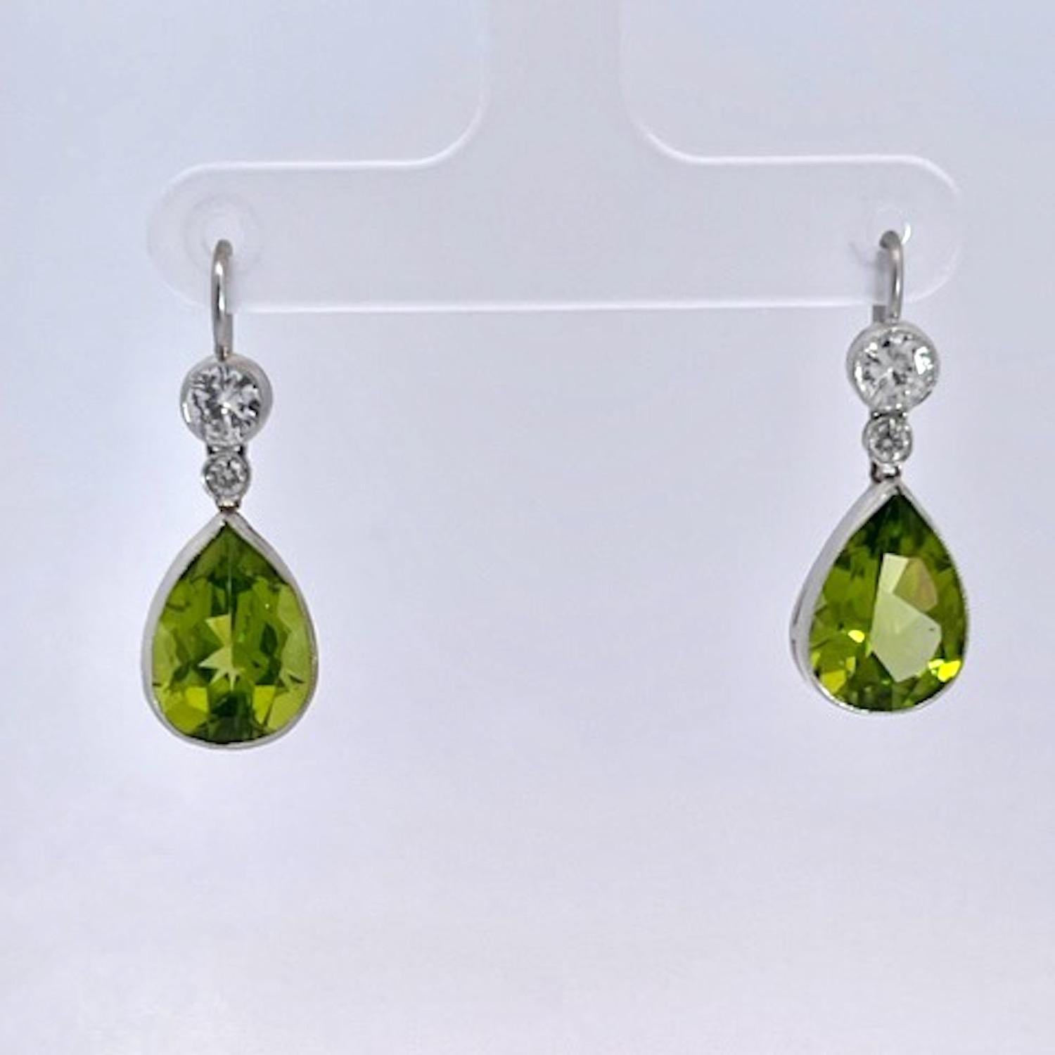 These Peridot Earrings are simple yet pack a punch.  August babies take note these are your birth stones.
These come out of Great Britain and are simple with Shepard hooks and are made from high carat gold. Each Peridot is pear shaped and weight in