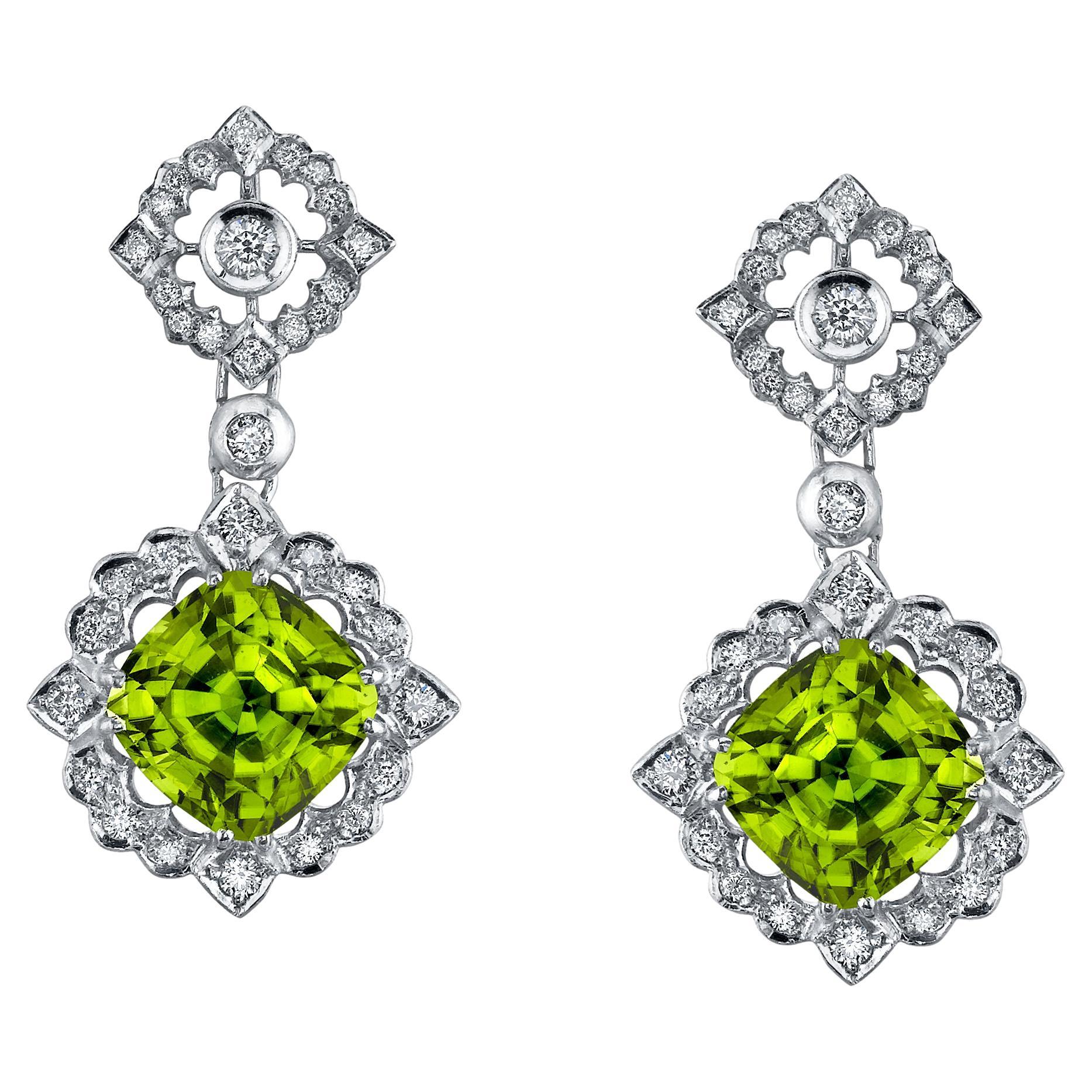 Remarkable pair of Peridots weighing a total of 12.89 carats, adorned by a total of 1.00 carat diamonds, set in 18K white gold Florentine style earrings.
Total length: 1.5 inches.
Returns are accepted and paid by us within 7 days of