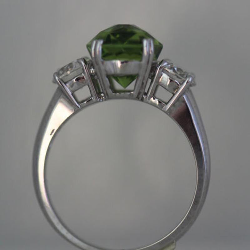 B45170003
Main Gemstone Specifications:
Carat Weight - 3.7+
Shape - 
Color - Intense Green
Clarity- VS (No inclusions visible to the eye very good clarity)
Cut - Excellent Cut with great refractive properites


Ring Specifications:

Finger Size: