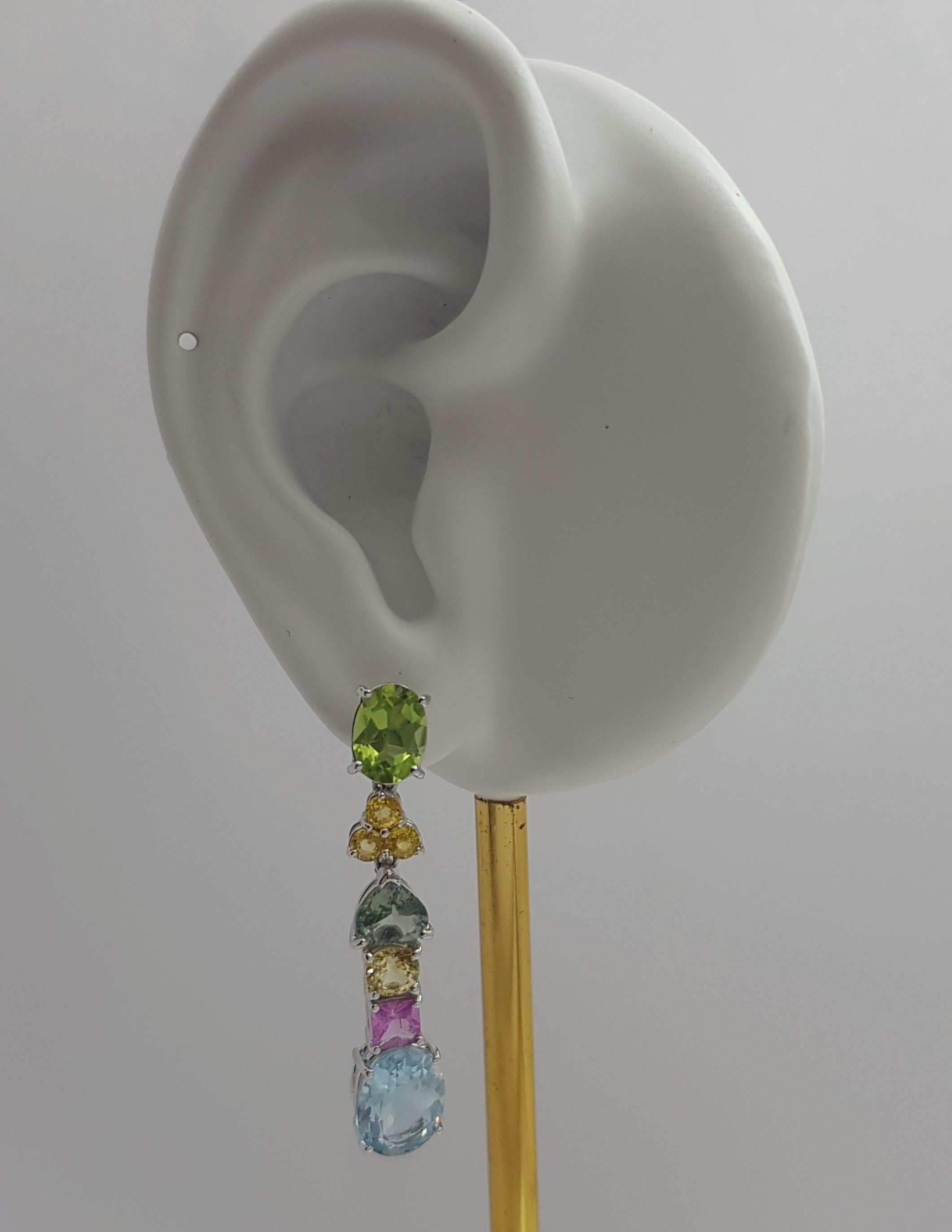 Peridot 2.56 carats, Yellow Sapphire 0.87 carat, Green Sapphire 1.80 carats, Yellow Sapphire 0.80 carat, Pink Sapphire 0.81 carat and Aquamarine 4.47 carats Earrings set in 18K White Gold Settings

Width: 0.8 cm 
Length: 4.0 cm
Total Weight: 9.08