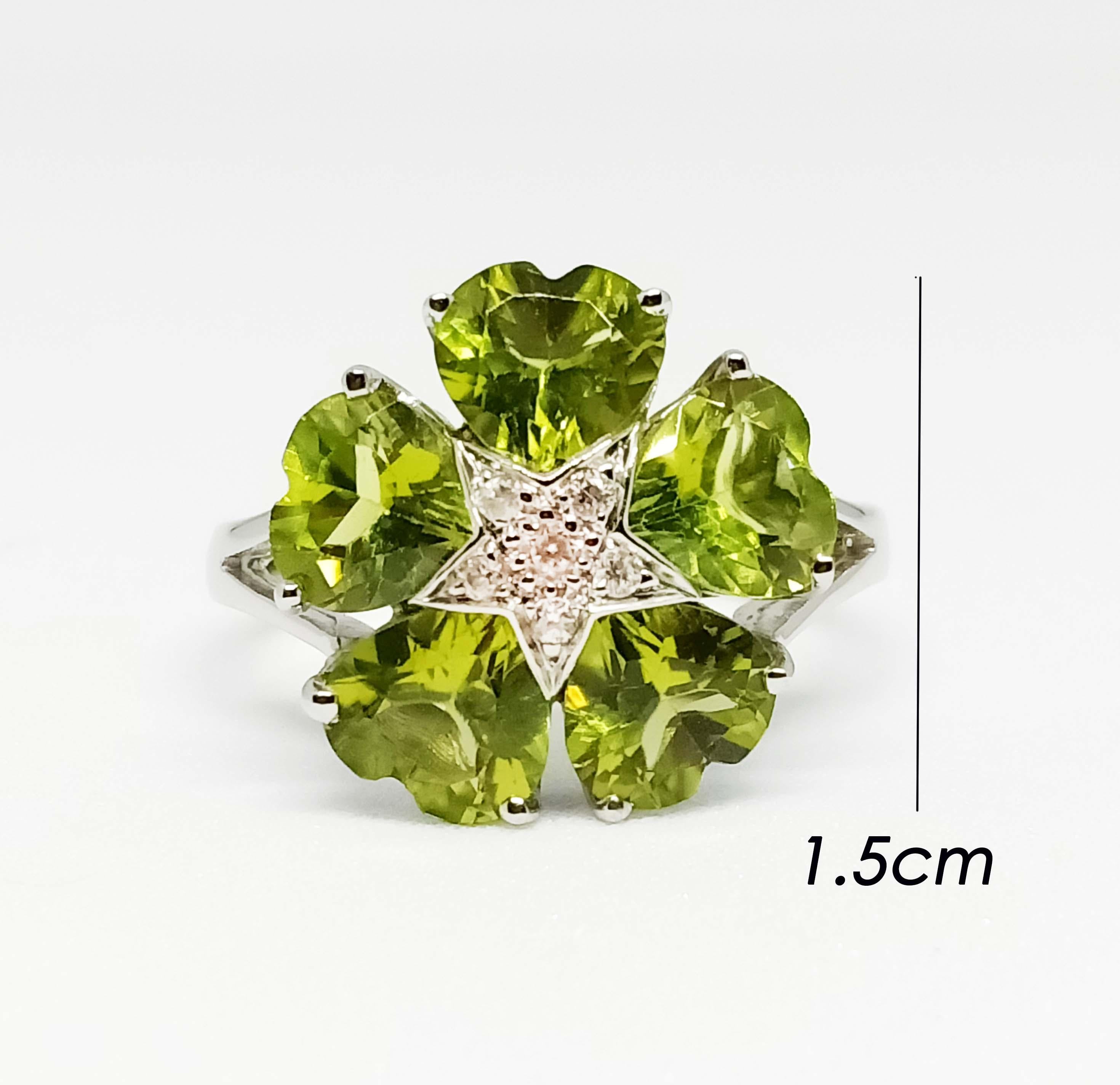 Peridot heart 6x6 mm. 5 pcs. 1.5 mm. 
White zircon 6 pcs.
White gold plated Over sterling Silver 
size 7 us.