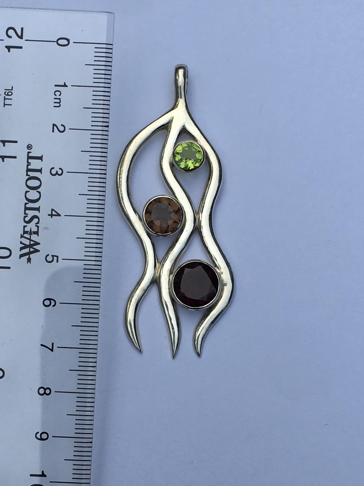Contemporary Peridot, Garnet and Smokey Topaz Pendant Set in Sterling Silver For Sale