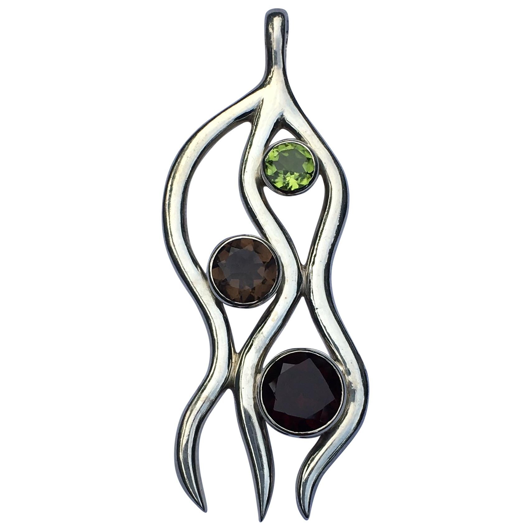 Peridot, Garnet and Smokey Topaz Pendant Set in Sterling Silver For Sale