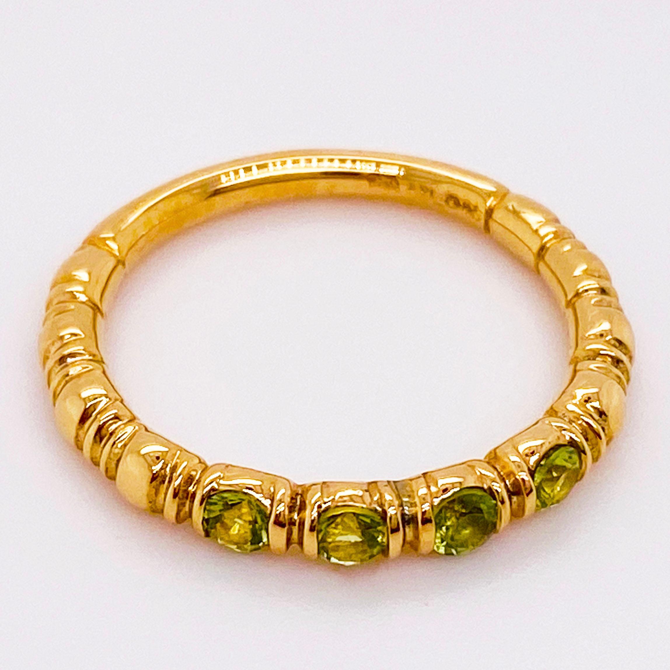Adorable, dainty August birthstone stackable band. The perfect birthday or anniversary gift for August celebrations! This peridot band has four genuine peridot gemstones set in vertical settings in 14 karat yellow gold. The peridot gemstone looks