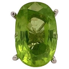 Peridot green oval shaped cocktail ring 18k white gold