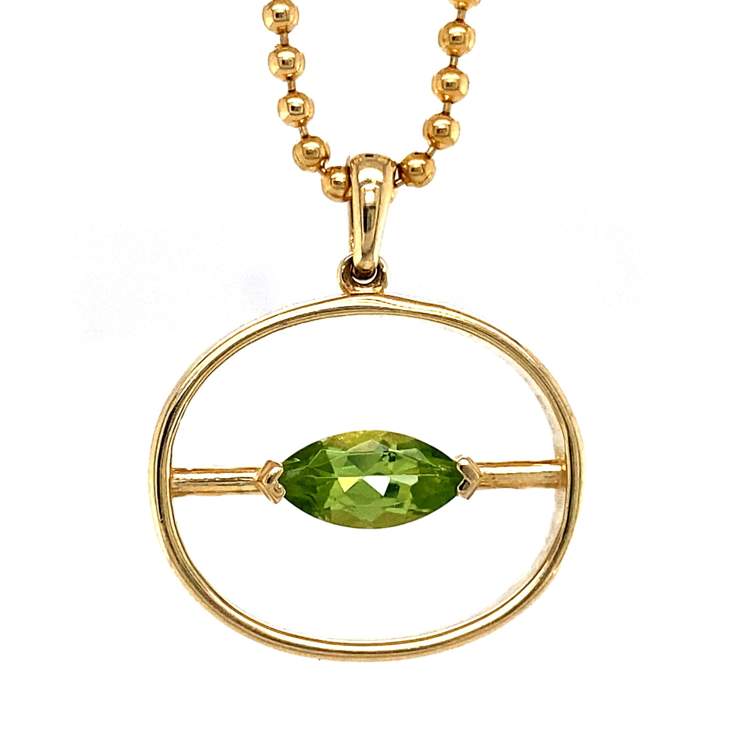 A vividly green 1/2 carat peridot sits in a clean little pronged basket mounted at the center of this inverted oval pendant by Eytan Brandes.

The resemblance to a lowercase Greek theta makes this the perfect signature piece for mathematicians,