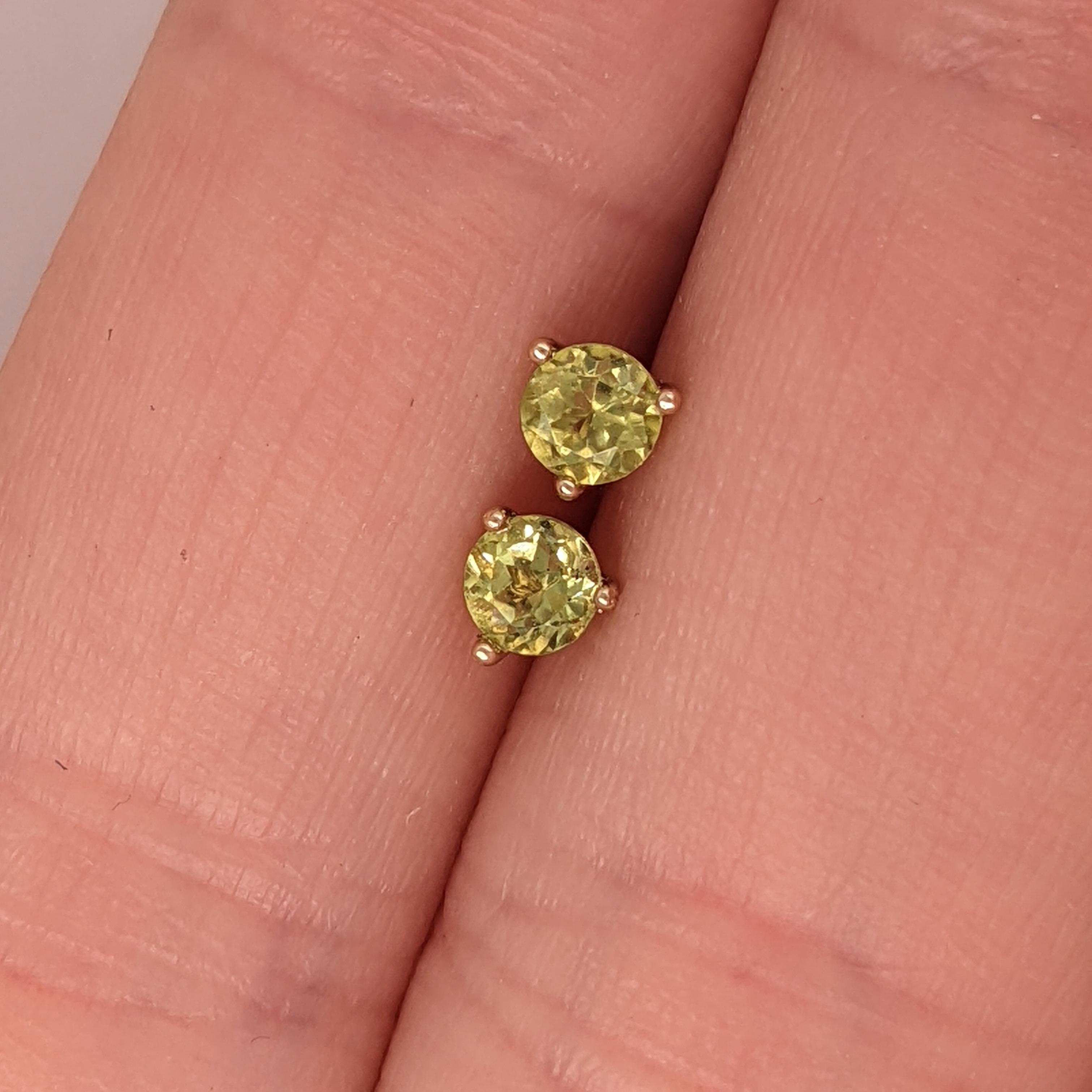 Peridot earrings bring a lively touch to any ensemble. The vibrant green stones, set in solid 14K gold, ensure they catch the eye even through your hair.

Let us know the gold color you would prefer. Available in solid 14k - yellow gold, white gold