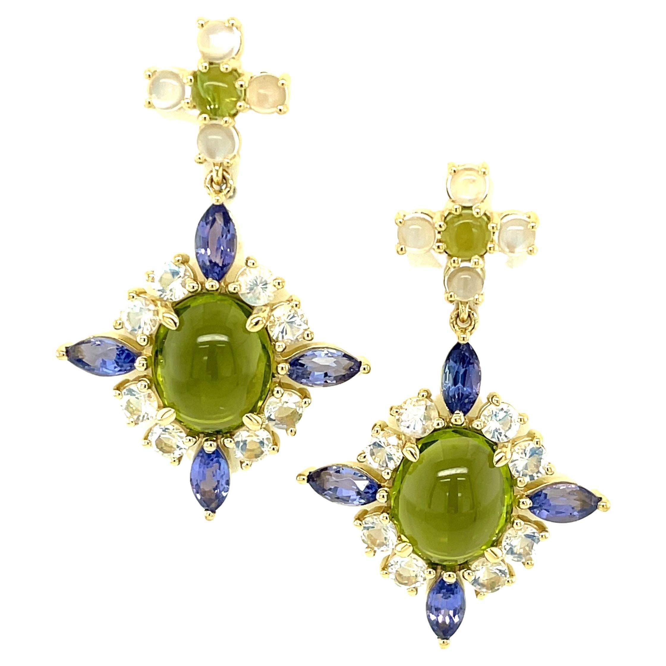 These regal earrings featuring peridots, moonstones and tanzanites are a gemstone lover's dream! Luscious green peridot cacochons are paired with blue flash moonstones and sparkling marquise-cut tanzanite in a beautiful arrangement of colors and