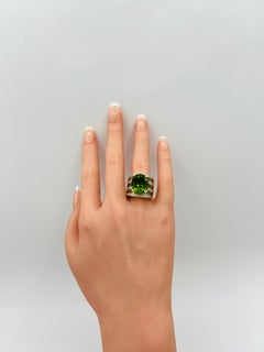 Peridot Oval and White Diamond Round Ring in 18K Yellow Gold