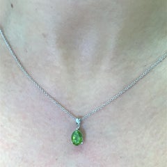Peridot oval shaped solitaire pendant necklace 18k white gold
