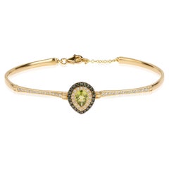 Peridot Pear Cut Bracelet in 18Kt Gold with Blue and White Pave Diamonds