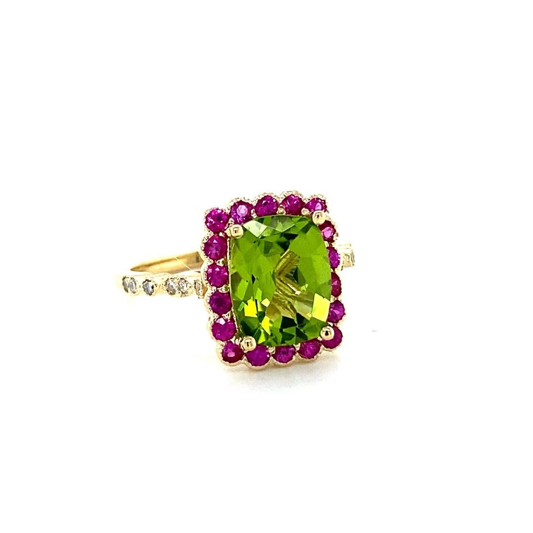 Peridot Pink Sapphire and Diamond Yellow Gold Cocktail Ring

This beautiful ring has a Cushion Cut Peridot that weighs 2.78 Carats. The ring is surrounded by 18 Pink Sapphires that weigh 0.57 Carats and 12 Round Cut Diamonds that weigh 0.11 Carats.